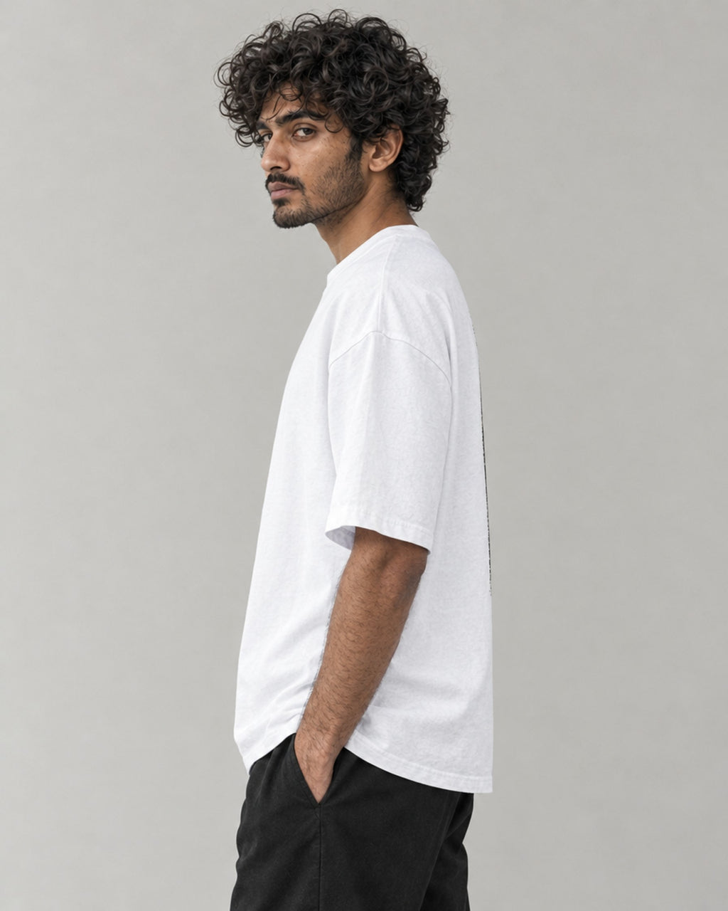 Kaavo Vasudeva oversized tee in White on model, side view